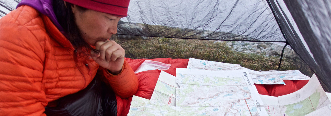 Szu-ting Yi looking over maps in the Winds